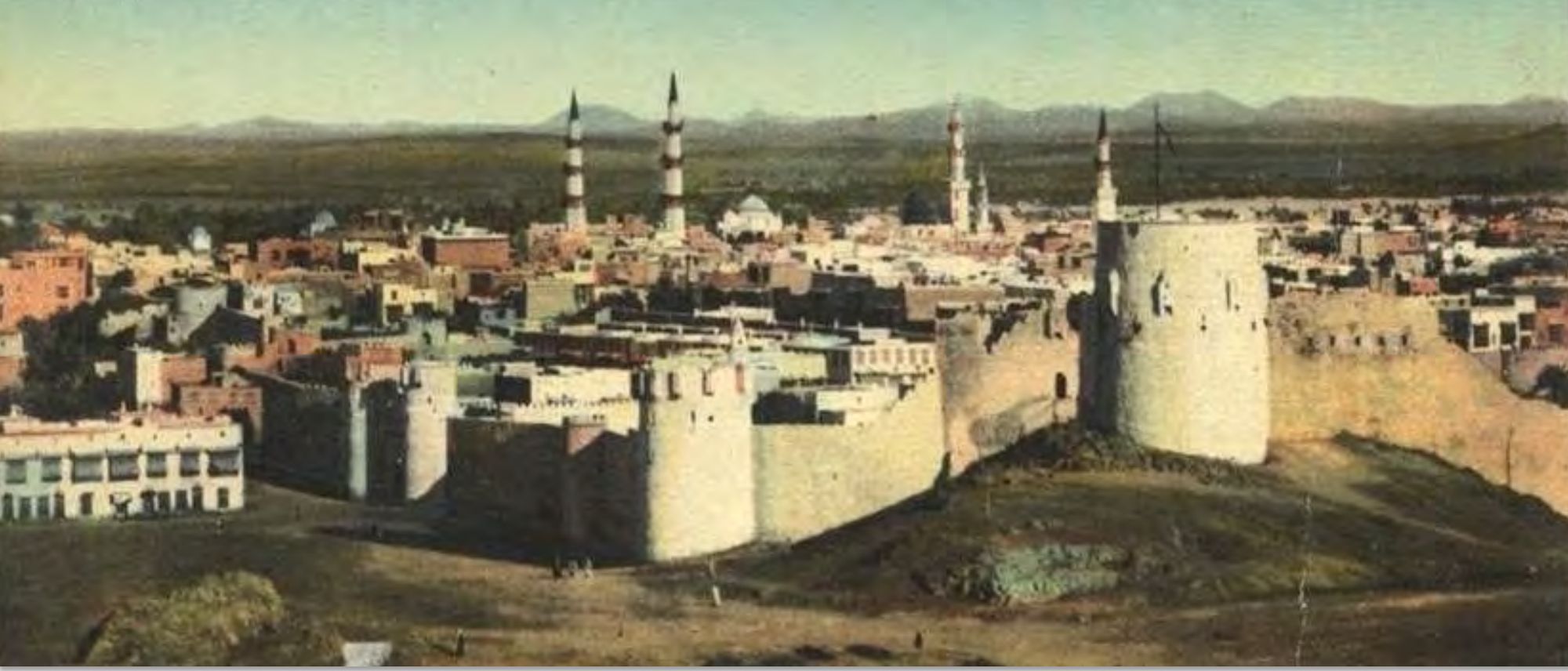 Historic photograph of Madinah and its walls